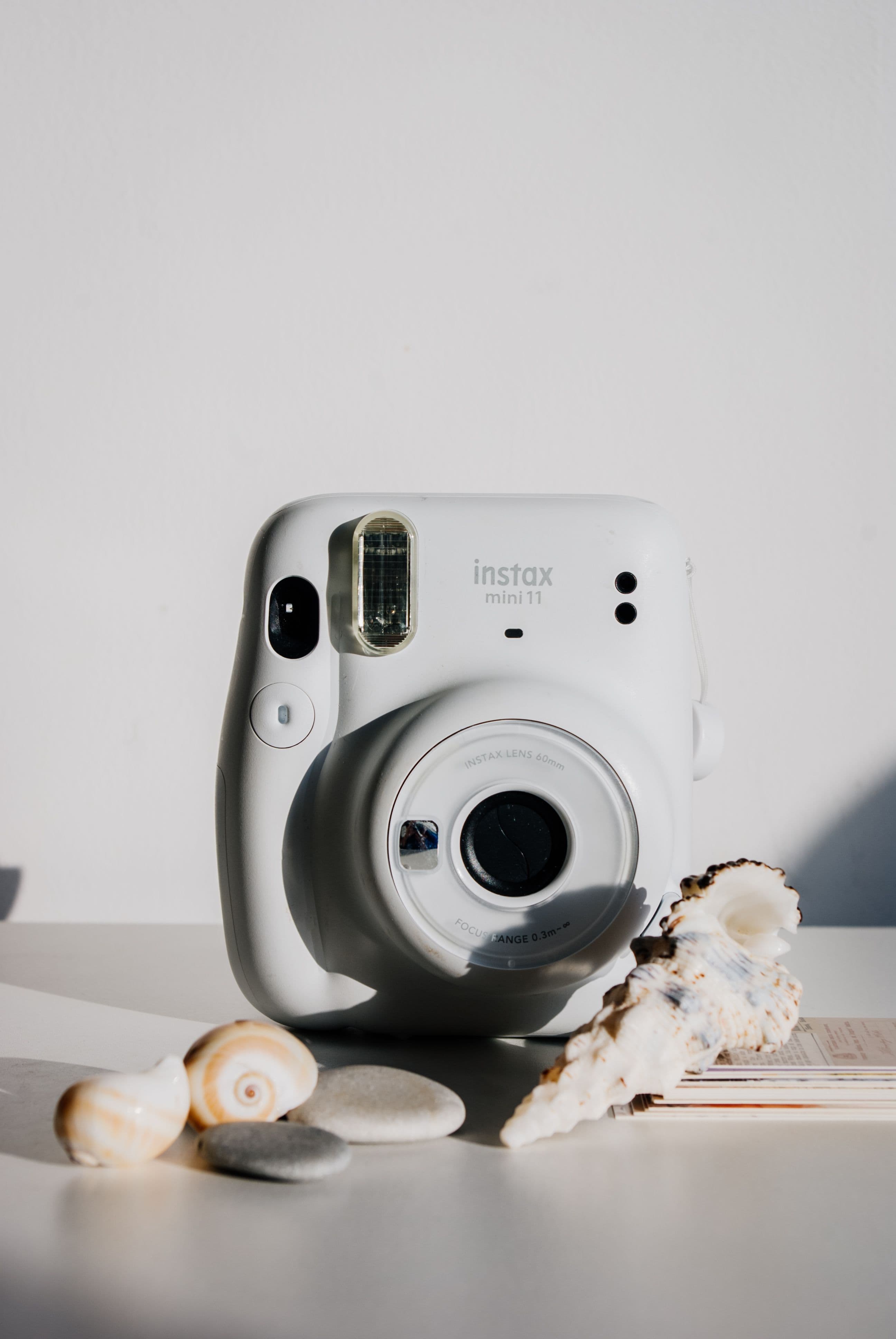 White Fujifilm Instax instant camera ready for a wedding